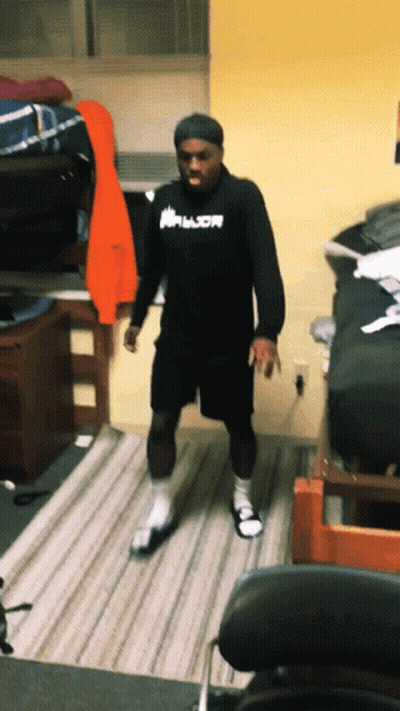 A Man Wearing A Black Shirt That Says Armor GIF