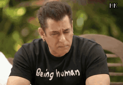 A Man Wearing A Black Shirt That Says Being Human On It GIF