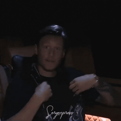 A Man Wearing A Black Shirt That Says Bergenpress GIF