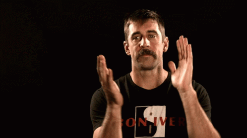 A Man Wearing A Black Shirt That Says Bon-Iver GIF