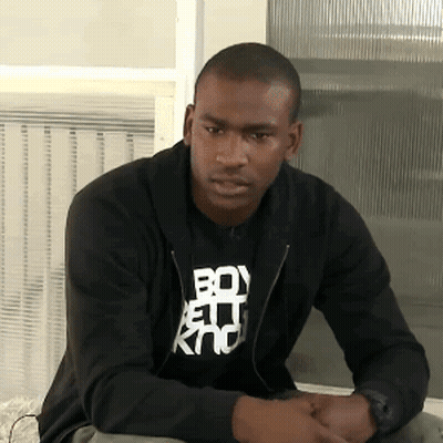 A Man Wearing A Black Shirt That Says Boy Kno GIF