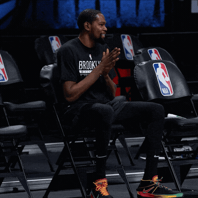 A Man Wearing A Black Shirt That Says Brooklyn Clapping GIF
