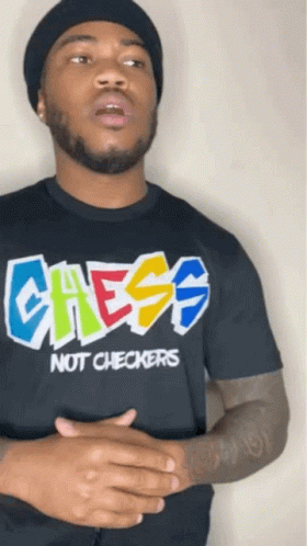 A Man Wearing A Black Shirt That Says Chess Not Checkers On It GIF