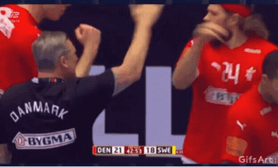 A Man Wearing A Black Shirt That Says Den On It GIF