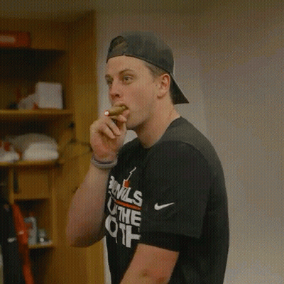 A Man Wearing A Black Shirt That Says Evils On It GIF