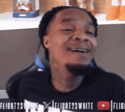 A Man Wearing A Black Shirt That Says Flight 23 White GIF