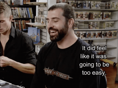 A Man Wearing A Black Shirt That Says Hate Your Deck On It GIF