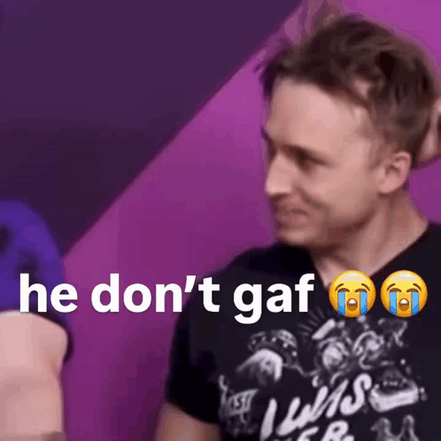 A Man Wearing A Black Shirt That Says He Don 'T Gaf GIF