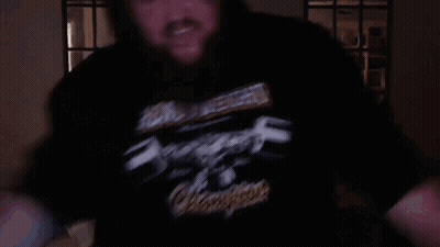 a man wearing a black shirt that says heavy metal