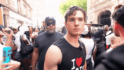 a man wearing a black shirt that says i love ny