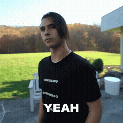 A Man Wearing A Black Shirt That Says Inhumano On It GIF