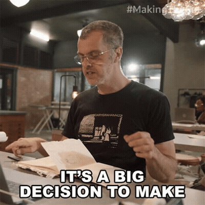 A Man Wearing A Black Shirt That Says " It 'S A Big Decision To Make " On It GIF