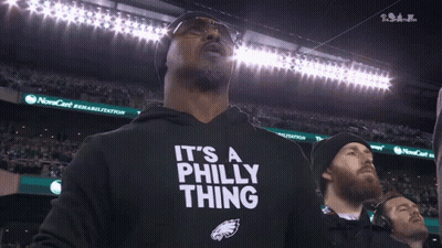 A Man Wearing A Black Shirt That Says " It 'S A Philly Thing " GIF