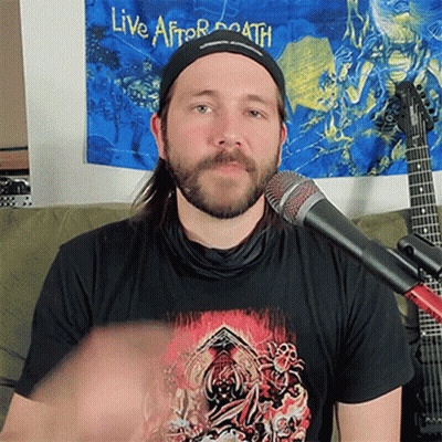 A Man Wearing A Black Shirt That Says Live After Death On It GIF