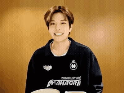 A Man Wearing A Black Shirt That Says Mahagri GIF