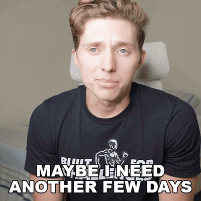 A Man Wearing A Black Shirt That Says " Maybe Need Another Few Days " GIF