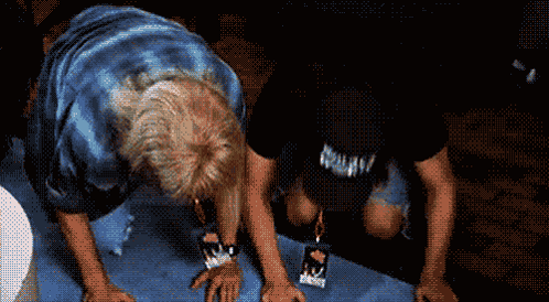 A Man Wearing A Black Shirt That Says Nirvana On It GIF