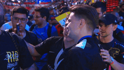 A Man Wearing A Black Shirt That Says Nvidia Smiles In Front Of A Crowd GIF