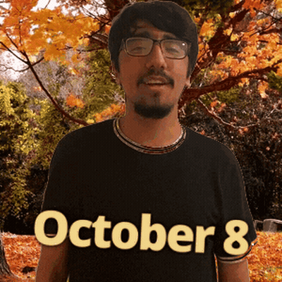A Man Wearing A Black Shirt That Says October 8 On It GIF