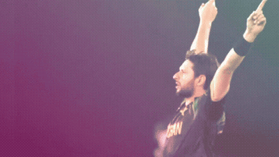 A Man Wearing A Black Shirt That Says ' Pakistan ' On It GIF