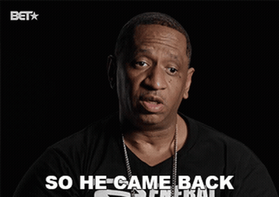 A Man Wearing A Black Shirt That Says So He Came Back On It GIF