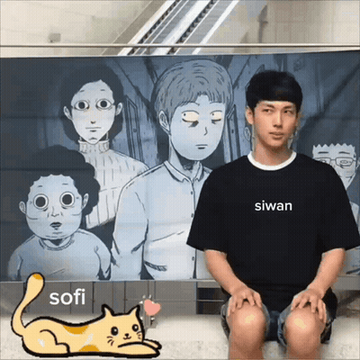 A Man Wearing A Black Shirt That Says Sofi Sits In Front Of A Poster GIF
