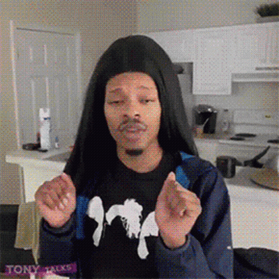 A Man Wearing A Black Shirt That Says Tony Talks Stands In A Kitchen GIF