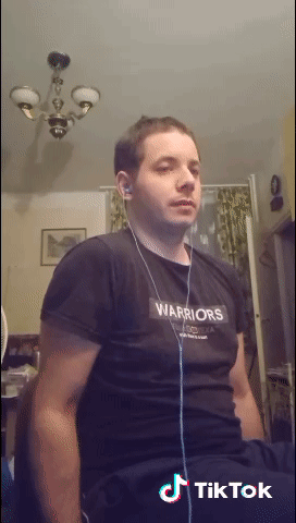 A Man Wearing A Black Shirt That Says Warriors On The Front GIF