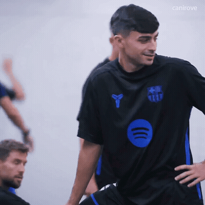A Man Wearing A Black Shirt With A Blue Circle On The Front And The Word Canirove On The Bottom GIF