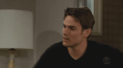A Man Wearing A Black Shirt With A Cbs Logo On His Sleeve GIF