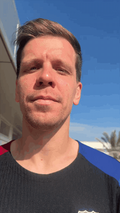 A Man Wearing A Black Shirt With A Fcb Logo On The Front Looks At The Camera GIF