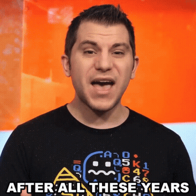 A Man Wearing A Black Shirt With A Ghost On It Says After All These Years GIF
