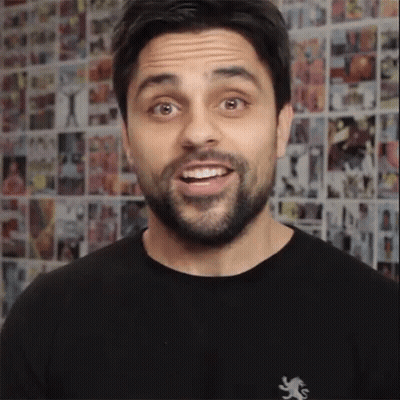 A Man Wearing A Black Shirt With A Lion On It GIF