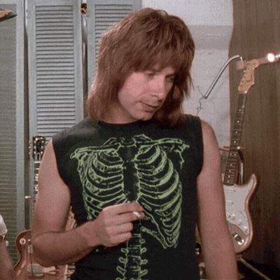 A Man Wearing A Black Shirt With A Skeleton Design On It GIF