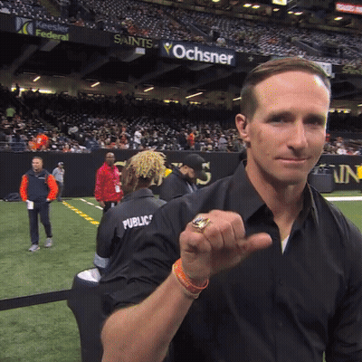A Man Wearing A Black Shirt With Public Written On It GIF