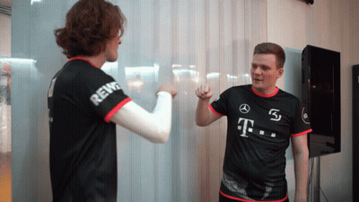 A Man Wearing A Black Shirt With T On It GIF