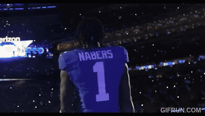 A Man Wearing A Black Shirt With The Number 2 On It GIF