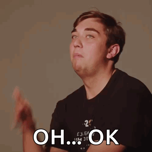 A Man Wearing A Black Shirt With The Number 20 On It Is Making A Funny Face And Says Oh Ok GIF