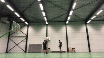 A Man Wearing A Black Shirt With The Number 22 On It Stands In Front Of A Basketball Hoop GIF