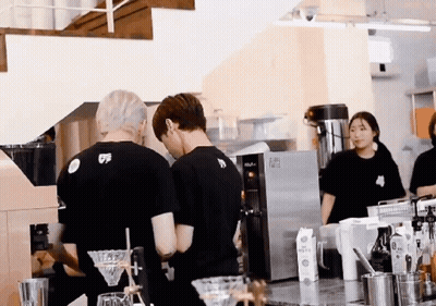 A Man Wearing A Black Shirt With The Number 5 On It Is Standing In A Kitchen GIF