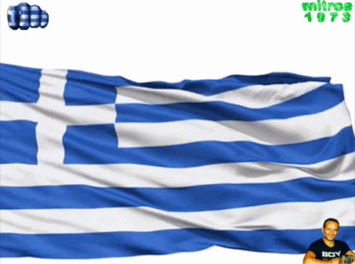 A Man Wearing A Black Shirt With The Word Boy On It Stands In Front Of A Blue And White Flag GIF