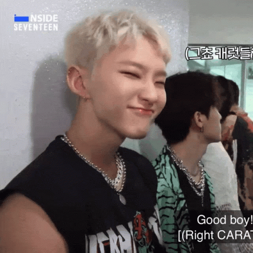 A Man Wearing A Black Shirt With The Word Inside Seventeen On It GIF