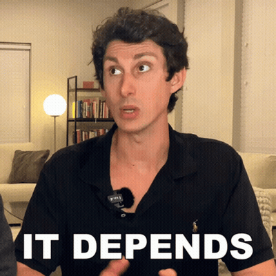 A Man Wearing A Black Shirt With The Word It Depends On His Chest GIF