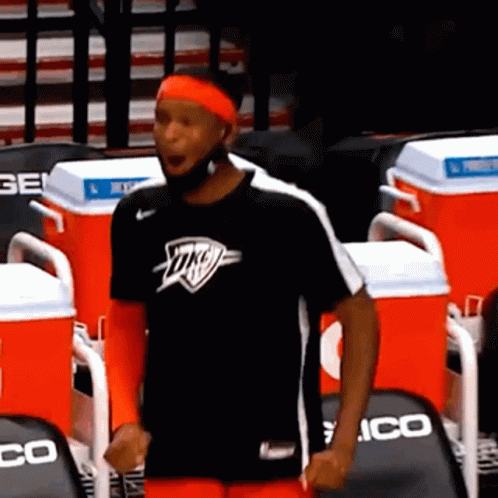 A Man Wearing A Black Shirt With The Word Okc On It GIF