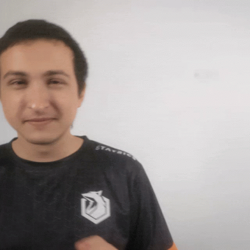 A Man Wearing A Black Shirt With The Word Stay On The Sleeves GIF