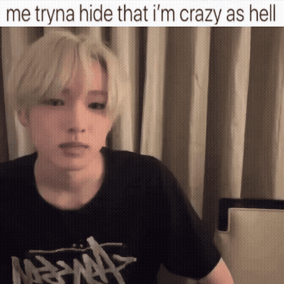 A Man Wearing A Black Shirt With The Words Me Tryna Hide That I 'M Crazy As Hell On The Bottom GIF