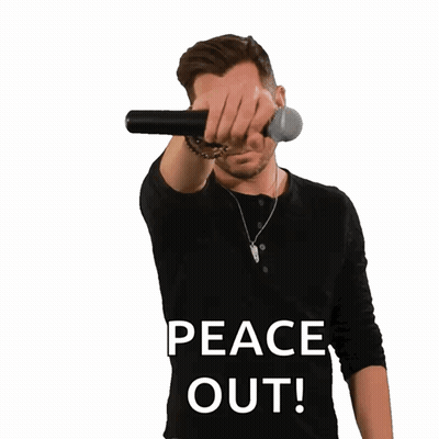 A Man Wearing A Black Shirt With The Words Peace Out On It GIF