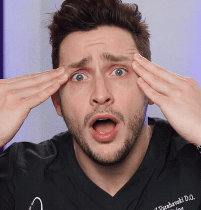 A Man Wearing A Black Shirt With Varsharski D.o. Written On It GIF