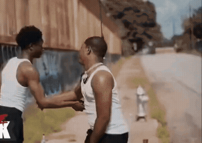A Man Wearing A Black Shorts With The Letter K On The Side GIF