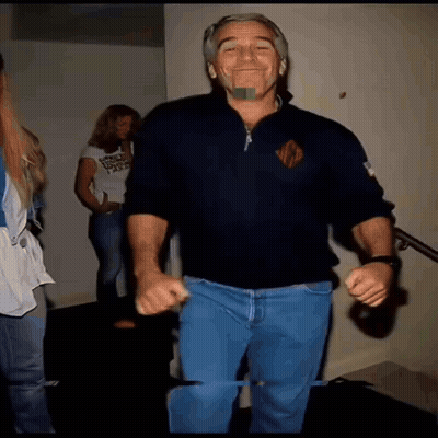 A Man Wearing A Black Sweater With The Letter R On The Front Is Dancing GIF